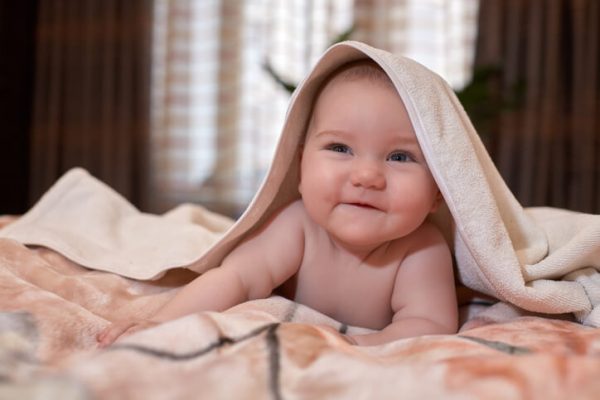 Sweet small baby with towel