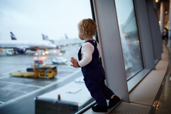 a young toddler at the airport