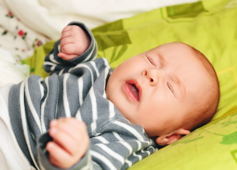 Sneezing newborn week-old baby