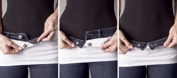 a pregnant woman wearing a belly button band