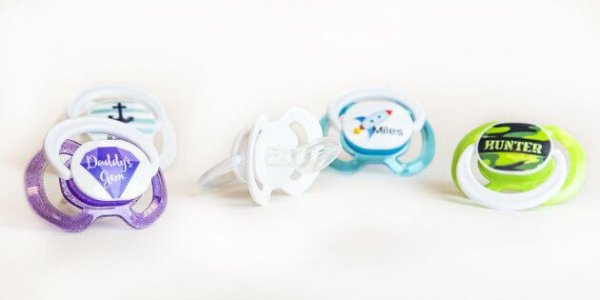 a selection of custom baby pacifiers