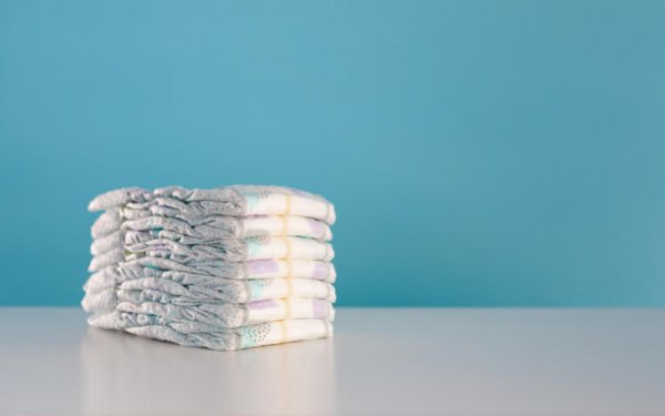 a stack of newborn diapers
