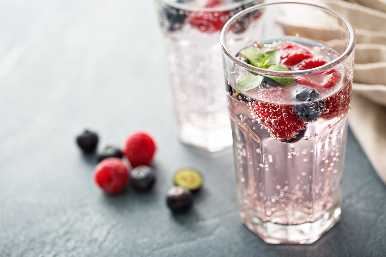 a glass of fruit infused seltzer water