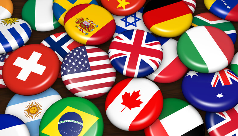 A pile of buttons with various flags and origins shown