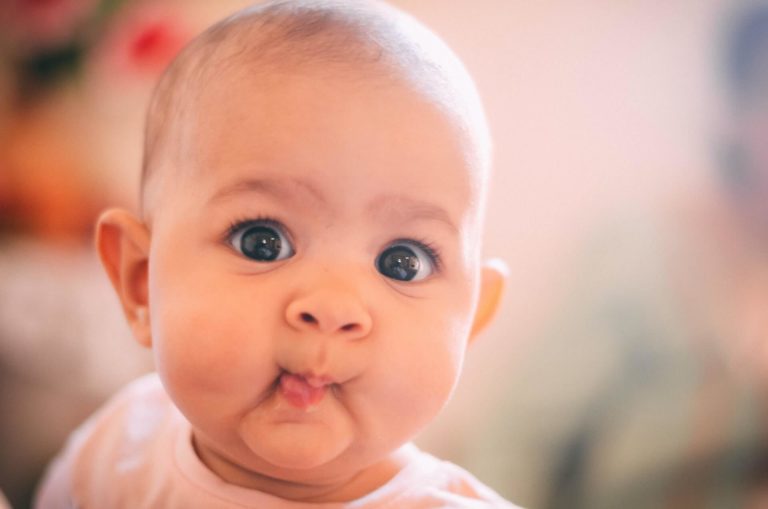 a cute baby making a funny face